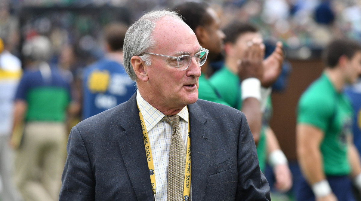 Notre Dame Fighting Irish athletic director Jack Swarbrick walks on the sideline at Notre Dame Stadium during the game between the Notre Dame Fighting Irish and the Virginia Cavaliers.